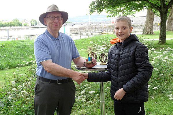 Conor Sheehan being presented by Ray with his Limerick Club Tom White Cup joint Best Junior trophy on 6th Aug 2022.